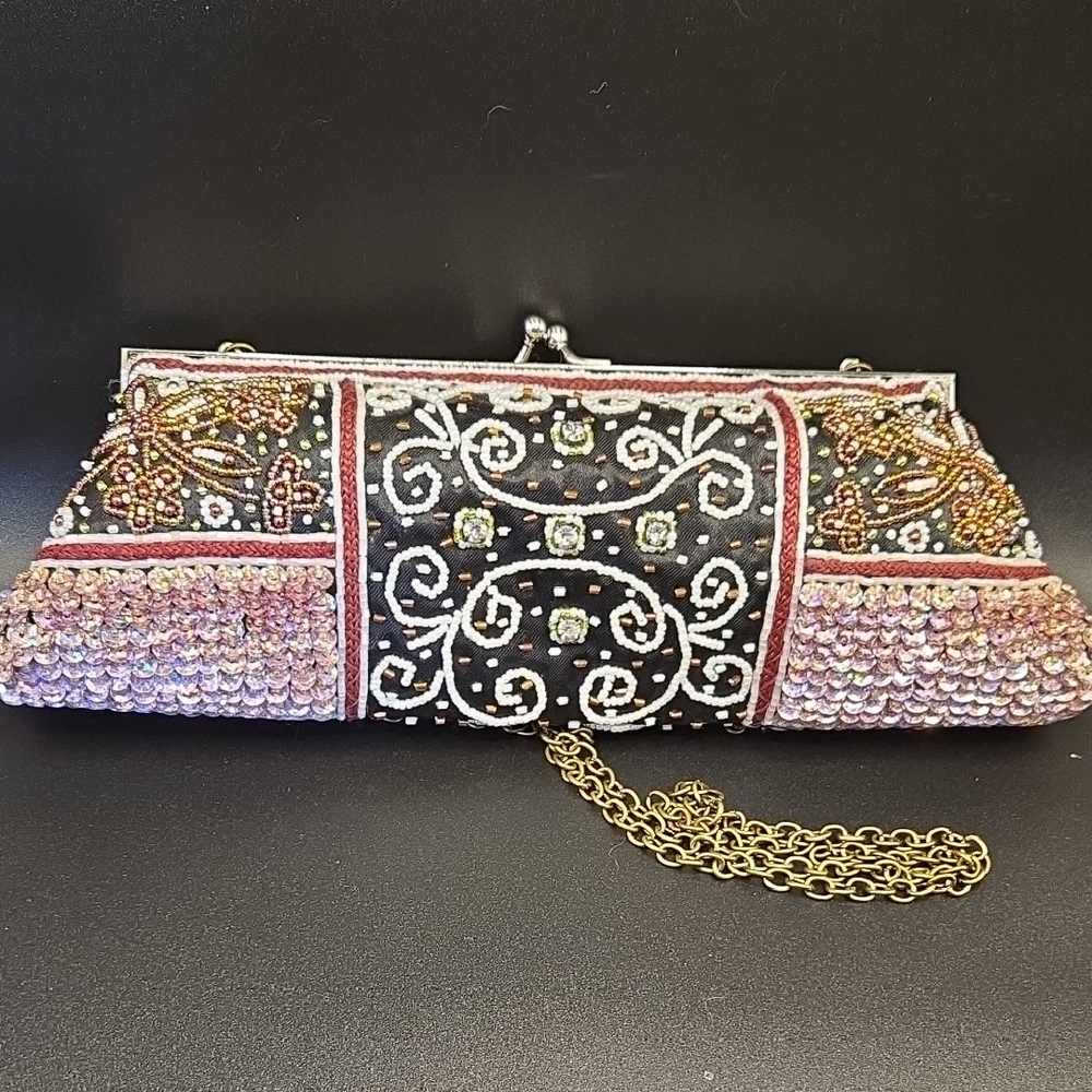 Elegant Black and Pink Clutch with Intricate Beadwork and Decorative Clasp
